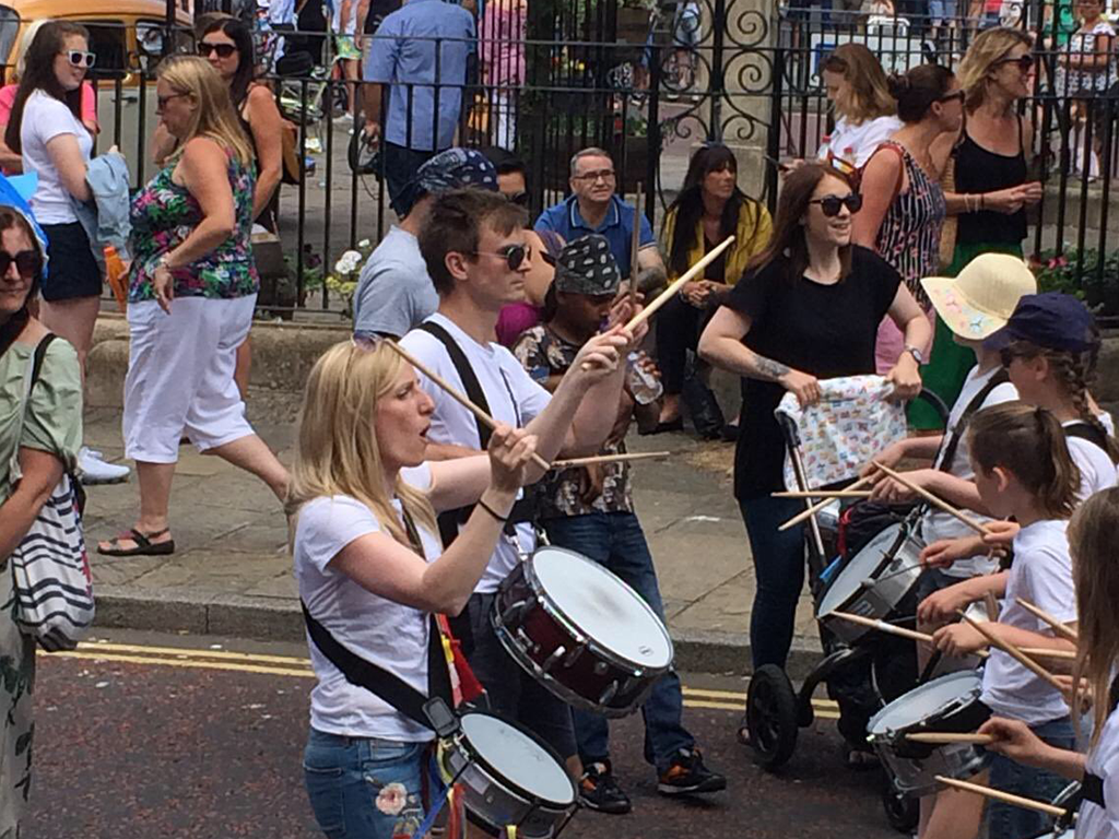 Children playing samba drums